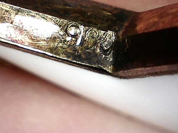 Figure 5: Silver content mark 900 on lower cross arm